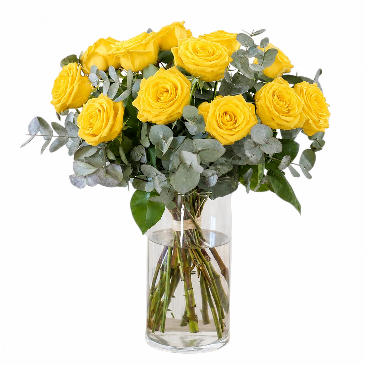 Ramo de rosas amarillas con eucalipto en jarrón - Floristería Peregrina